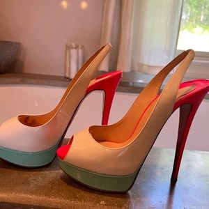 Louboutin 4.5 heels.  Used.  Please see photos for scuff marks & wear.